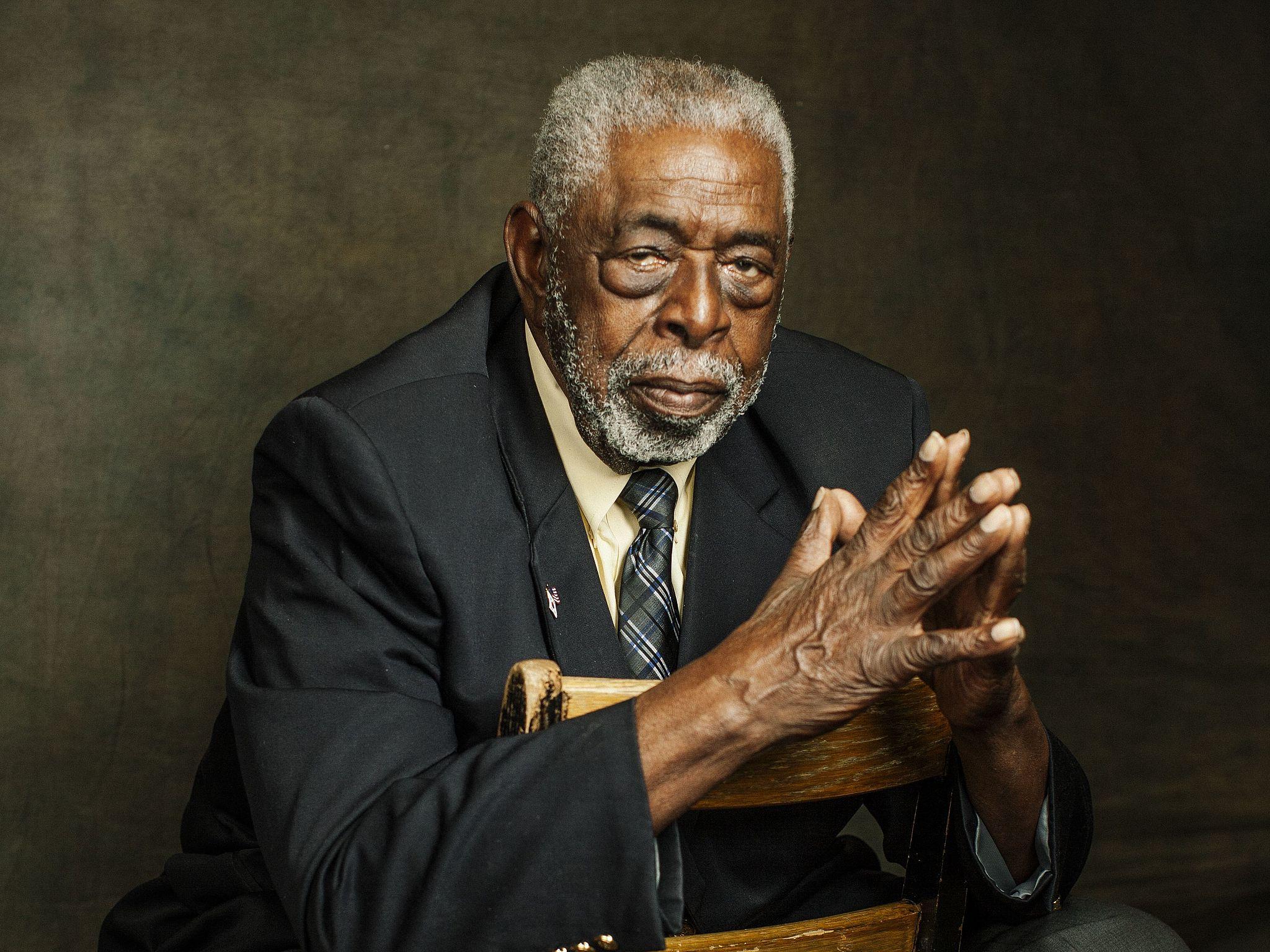 Portrait of Donald Blake wearing a dark suit.