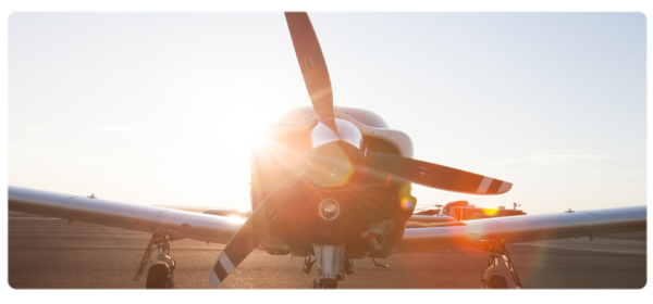 Airplane with sun shining from the back